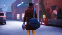 Payday 3 character wearing a long brown coat and yellow pants stands with his back facing us, a clown mask in hand and a blue duffle bag over his shoulder