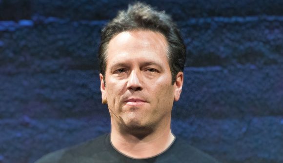 Phil Spencer leak response: An image of Phil Spencer standing against a blue background, wearing a black shirt