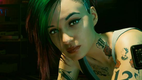Cyberpunk 2077 HD Reworked Project 2.0 - Judy Alvarez, a tattooed woman with green and pink hair, leans over you.