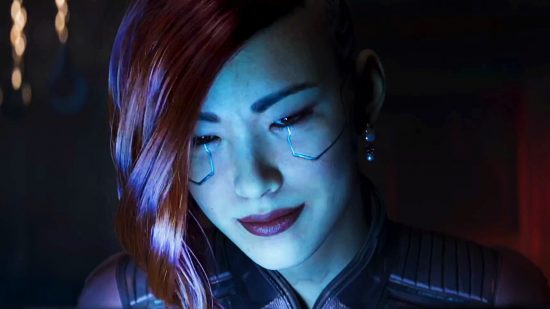 Cyberpunk 2077 Phantom Liberty build planner - A red-headed woman smiles in the glow from a computer monitor.