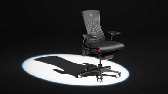Herman Miller G2 Esports Embody gaming chair: a black chair with red splashes appears in a white spotlight with a black background.