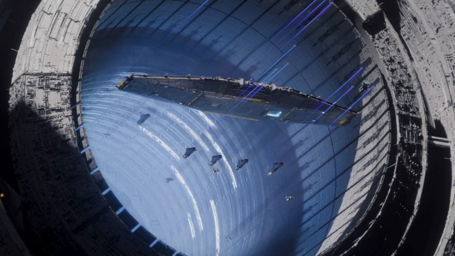 Shapeships fly out of a circular tunnel in Homeworld 3.