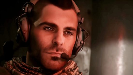 Soap McTavish, played by Neil Ellice in the Modern Warfare 3 cast, wears a headset and looks somberly into the distance. 