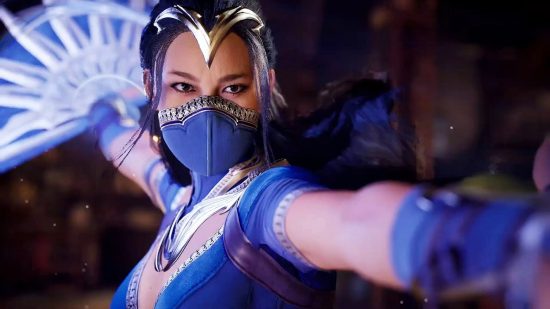 Mortal Kombat 1 has the best single-player mode in fighting games: An Asian woman wearing a blue mask with golden dots stands reaching out one hand holding a fan behind her with the other