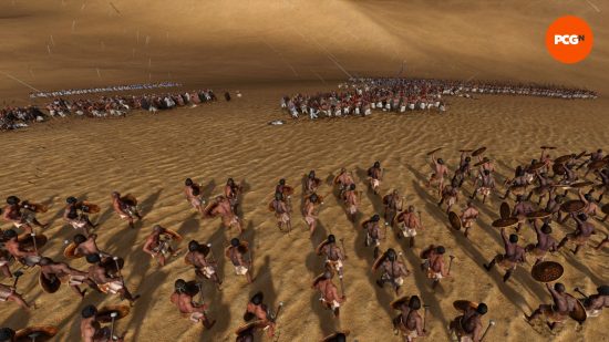 An army of troops waiting for archers to attack another army before approaching in a desert area