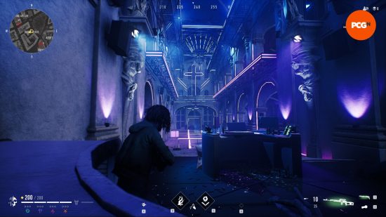 A character with dreadlocks wearing a green hoodie crouching in a blue and purple neon disco, a neon crucifix sign hands on the wall ahead of the DJ booth