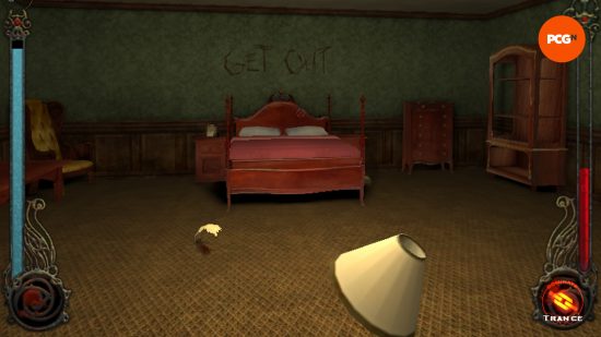 A dark dreary bedroom with furniture scattered all over the floor and 'get out' scratched into the wall above the bed