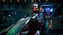 RoboCop free Steam download: A man with a robotic titanium body leaves a car, his hand on the front door as he stares ahead