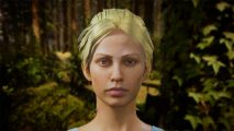 Sons of the Forest update: Virginia, a young woman with blonde tied-back hair, stares ahead blankly with a forest behind her
