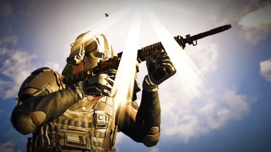 XDefiant delay: A man wearing army armor and a helmet holds an automatic rifle, the sun blaring above him