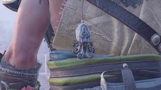 A squid-like emblem is hanging off Basim's back, and is one of the AC Mirage talismans.