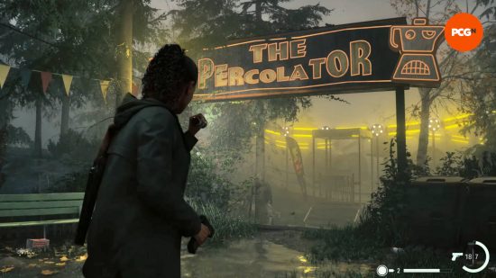 Alan Wake 2 gift shop safe: Saga is shining her flashlight on a sign for a ride called The Percolator. The ride is lit up and spinning behind the sign.