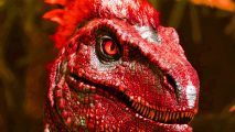 Ark Survival Ascended system requirements: a red dinosaur with a wide mouth filled with sharp teeth appears in the middle of the screen.