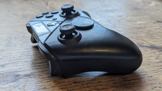 Asus ROG Raikiri Pro review: a black controller appears side-on on a wooden desk.