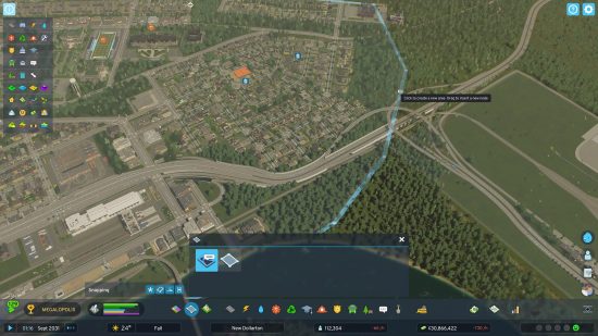 Cities Skylines 2 garbage: an overheard view of a city, and a cursor outlining a district.