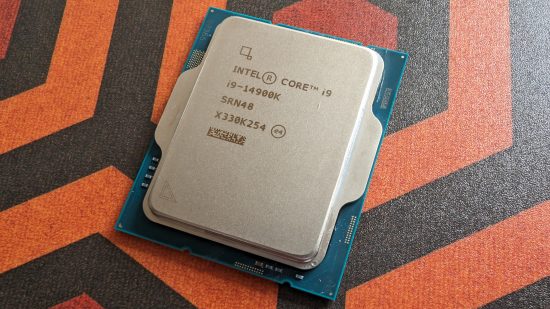 The Intel Core i9 14900K against an orange-red-black geometric background