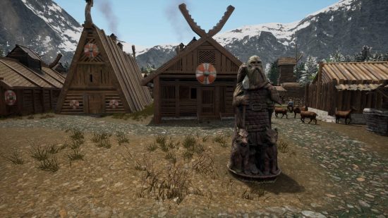 A viking settlement with a totem standing in front of a wooden house
