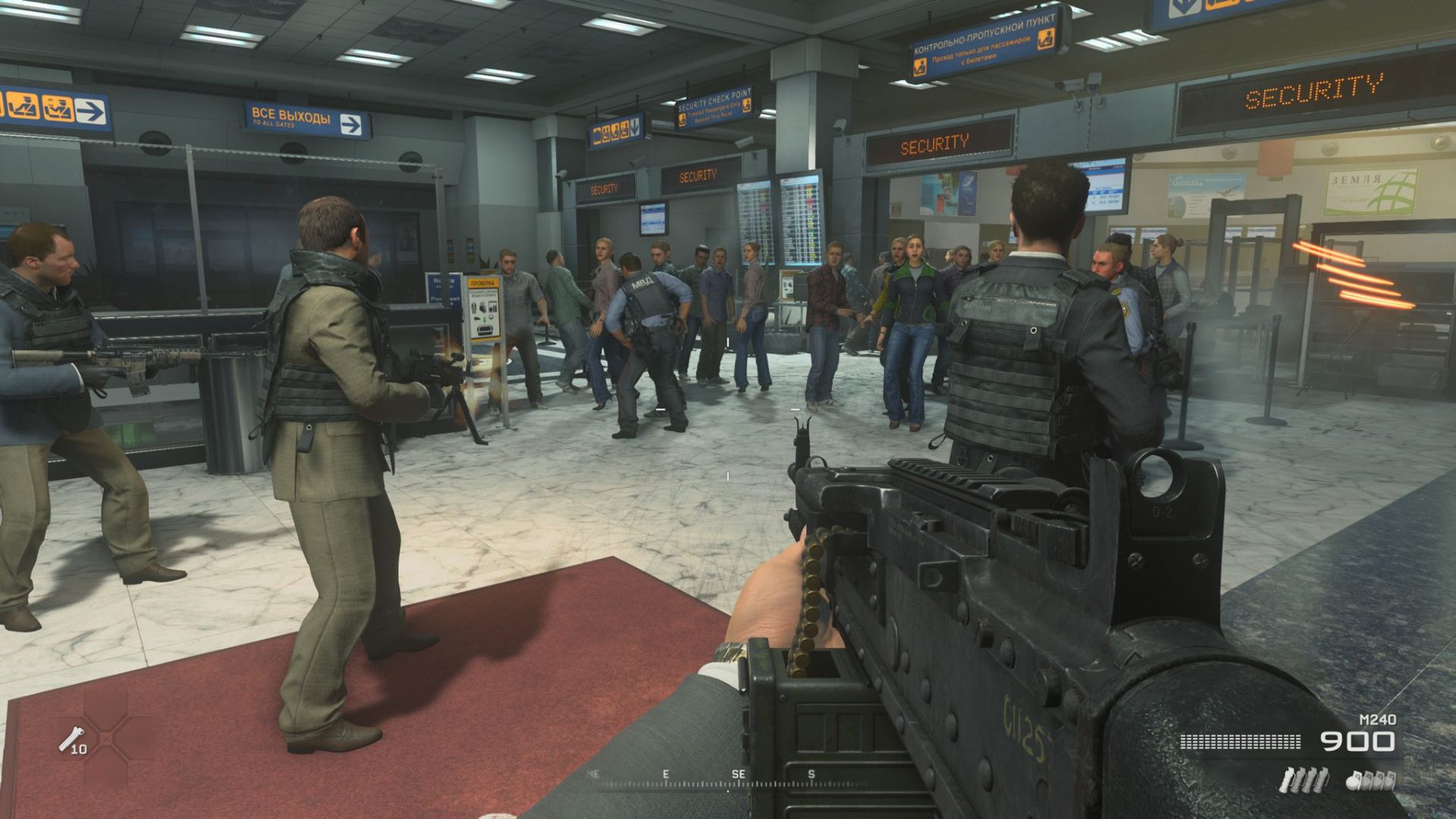 MW3 No Russian: armed men aiming weapons at a crowd of civilians in an airport.