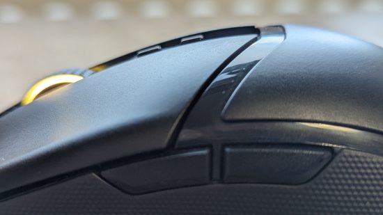 Razer Cobra Pro review: a black mouse with multicolored RGB appears side-on on a wooden surface.