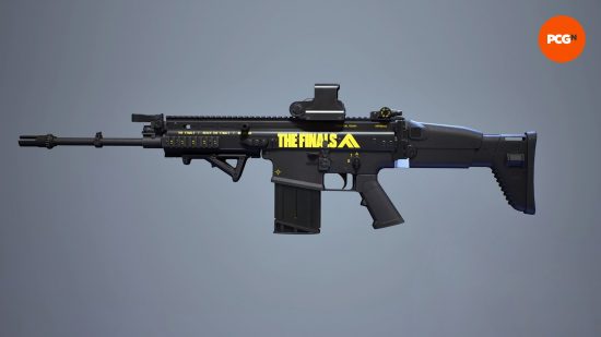 The Finals best weapons: a black assault rifle weapon with yellow writing.