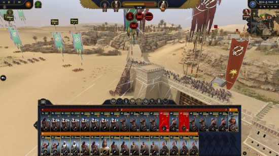 A side view of ancient Egyptian troops climbing a siege tower and firing arrows next to a fortress wall from Total War: Pharaoh