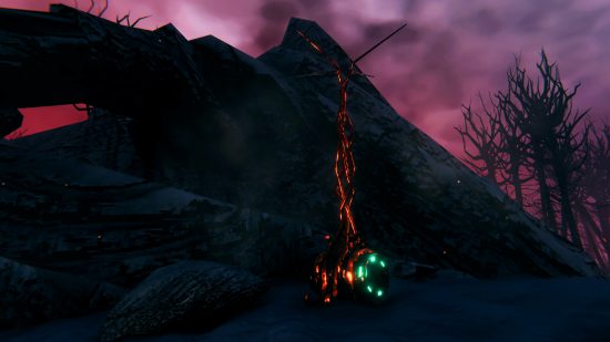 Valheim Ashlands - A mysterious contraption with glowing green lights and molten strands rising up from it.