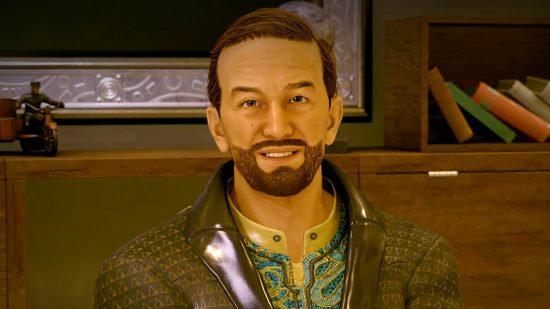 Starfield update graphics: A bearded man with short brown hair smiles, wearing a patterned white and teal shirt