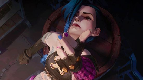 I asked League of Legends' EP about a very real Arcane season 2 "spoiler": A young cartoon woman with blue lies back grimacing pointing her fingers in a gun shape up at the camera wearing black leather gloves and a black crop top