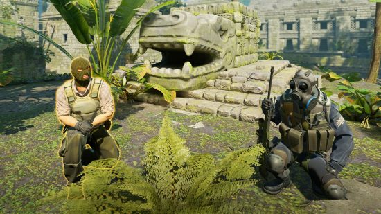  two soldiers take a knee in an old ruin.