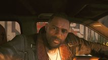 Cyberpunk 2077 Ultimate Edition: Idris Elba in Cyberpunk sat in a car
