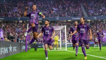 Players in purple kits jump and celebrate a Football Manager 24 review goal