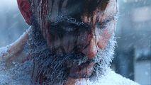 Frostpunk 2 gameplay teaser - A man with a handlebar beard looks down, frost and blood covering his face and hair.