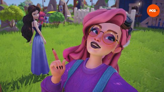 A pink-haired player and Ursula, as Vanessa, pose for a selfie in Dreamlight Valley, one of the best games like The Sims.