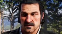Red Dead Redemption 2 sets new Steam player count high amid Steam sale - Dutch Van der Linde, a black-haired man with moustache and goatee, stands outdoors in the woods.