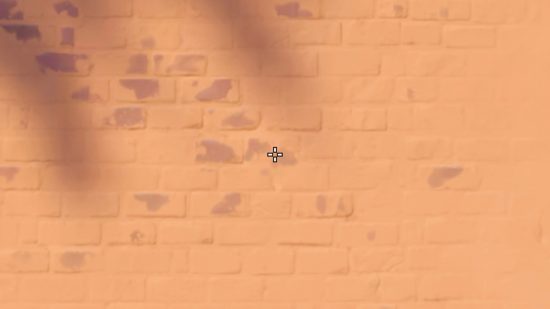 dephh Valorant crosshairs: A white cross with a black outline on a wall in Valorant.