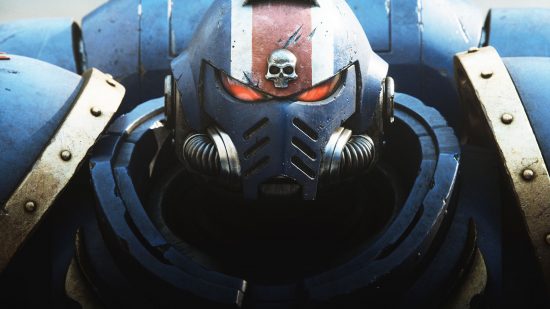 A Warhammer 40K space marine, in his armoured suit, looking at the viewer with red eye-pieces.