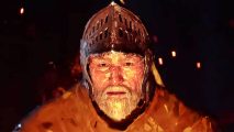 Dark and Darker update: A man wearing an open metal helm stares ahead at a fire, his face expressionless and bearded with white hair