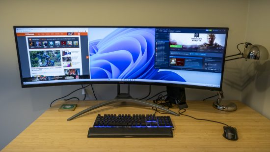 The AOC Agon AG493UCX2 monitor on a bamboo desk