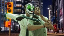 A clown mask wearing robber with a hostage in front of some night-time city streets.