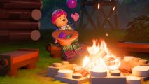 Lego Fortnite Loot Llama: a lego person sits next to a camp fire.