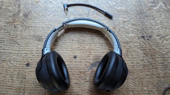 LucidSound LS100X review: a black gaming headset sits on a wooden table.