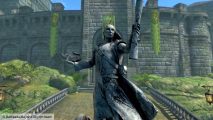 Beyond Skyrim mod voice lines: a stone statue holding a scroll, in front of a bridge and castle walls