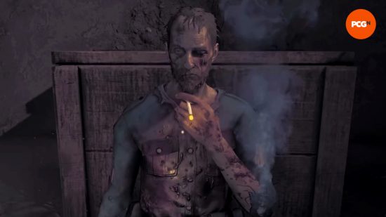 Los mejores juegos de Steam Winter Sale 2023: Amnesia: The Bunker.  Un hombre demacrado está sentado contra una caja, sosteniendo un cigarrillo encendido.