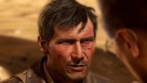 Indiana Jones and the Great Circle reveal: A man with short brown hair stares ahead at another man, a sandy background behind him