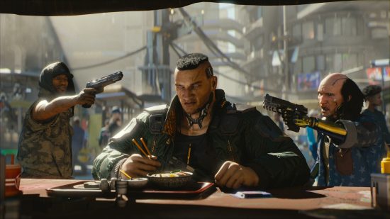 Image of a man being interrupted while eating at a food stand by men with guns pointed at his head.