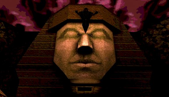 Quake new game: A pyramid-like head with a floating black figure above it and a red sky behind it