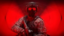 The Finals new mode: A man wearing a full set of military gear, including a full face covering and sunglasses over it, stands against a red blurred backdrop with his rifle in hand