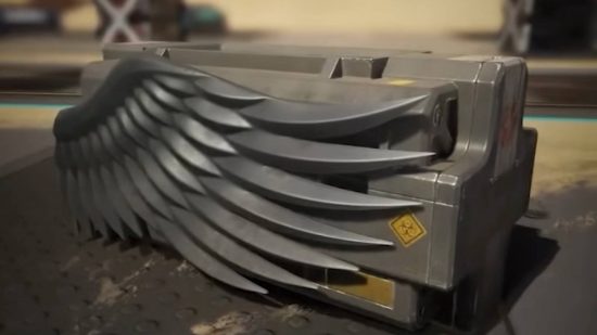 An ornate death box from Apex Legends with a wing on it