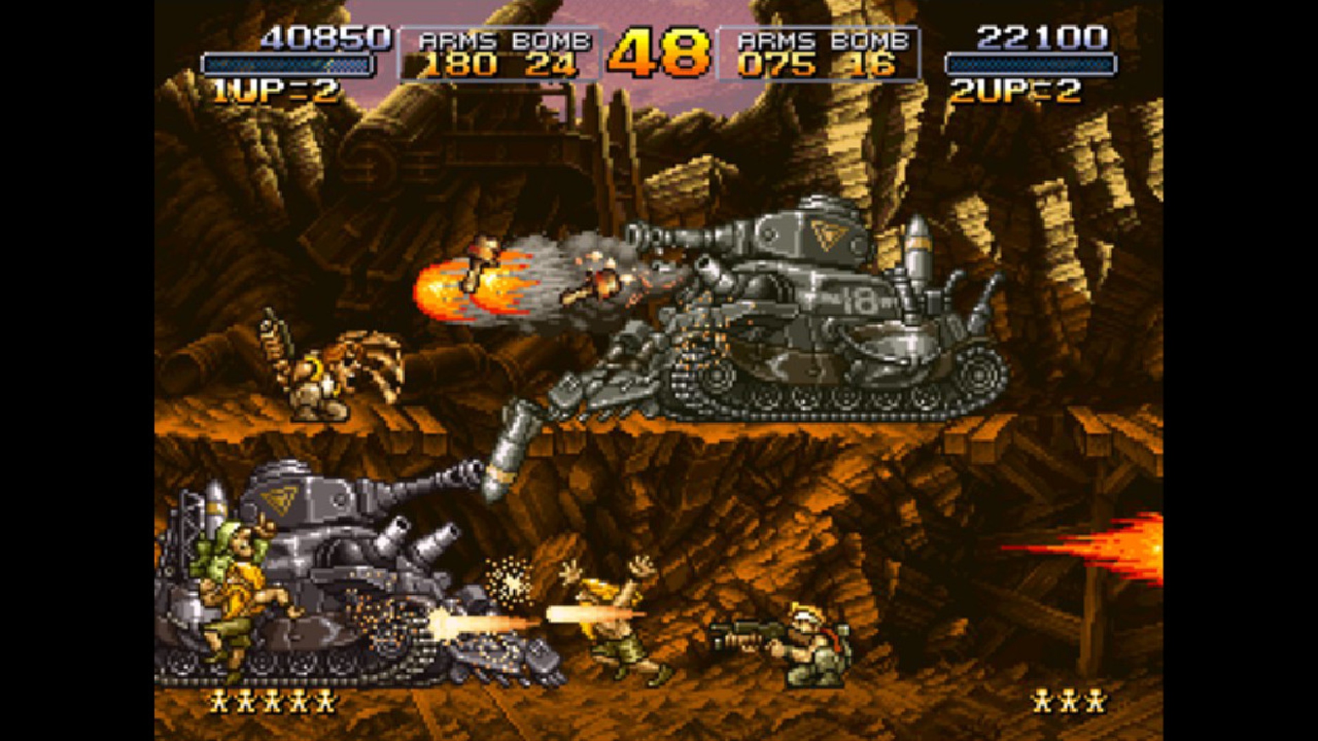 Best tank games: Metal Slug. Image shows two tanks with two players attacking them in a screenshot from the game.