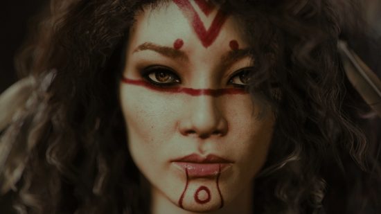 Baldur's Gate 3 mods: a woman with curly hair and red tattoos on her face.